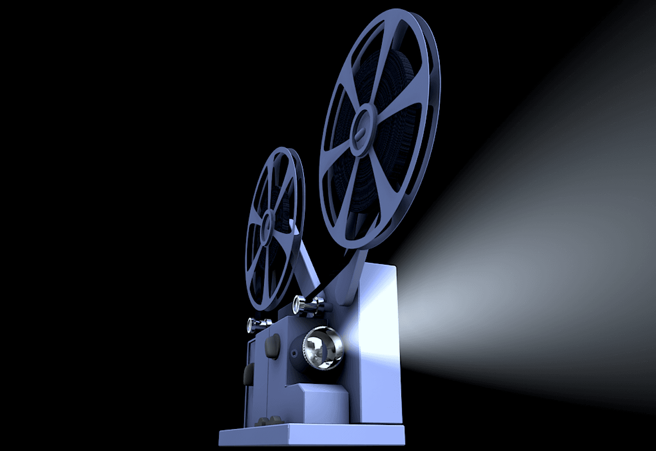 Projetor de cinema antigo iluminando a tela