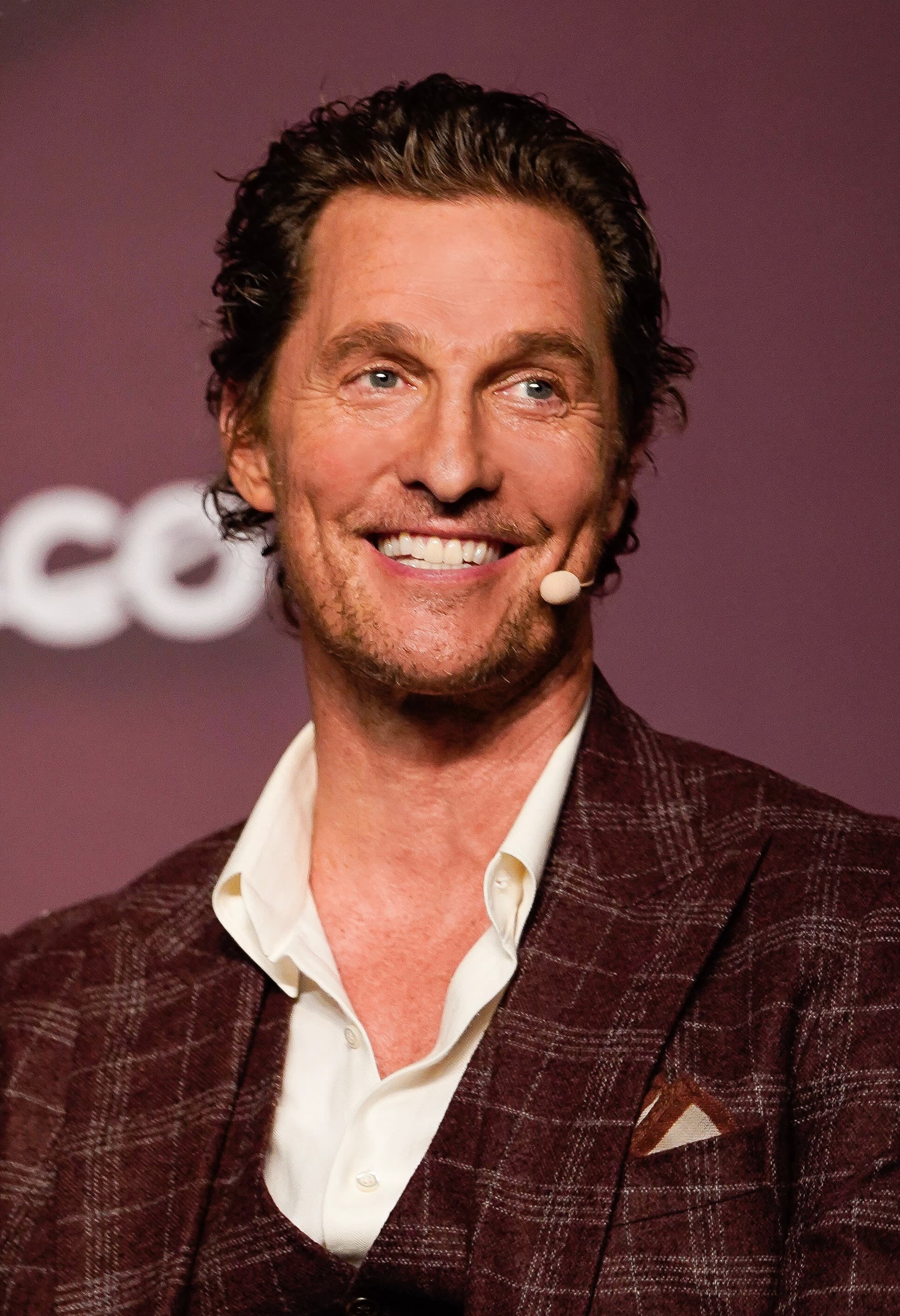 Retrato de Matthew McConaughey sorrindo em evento público, 2019